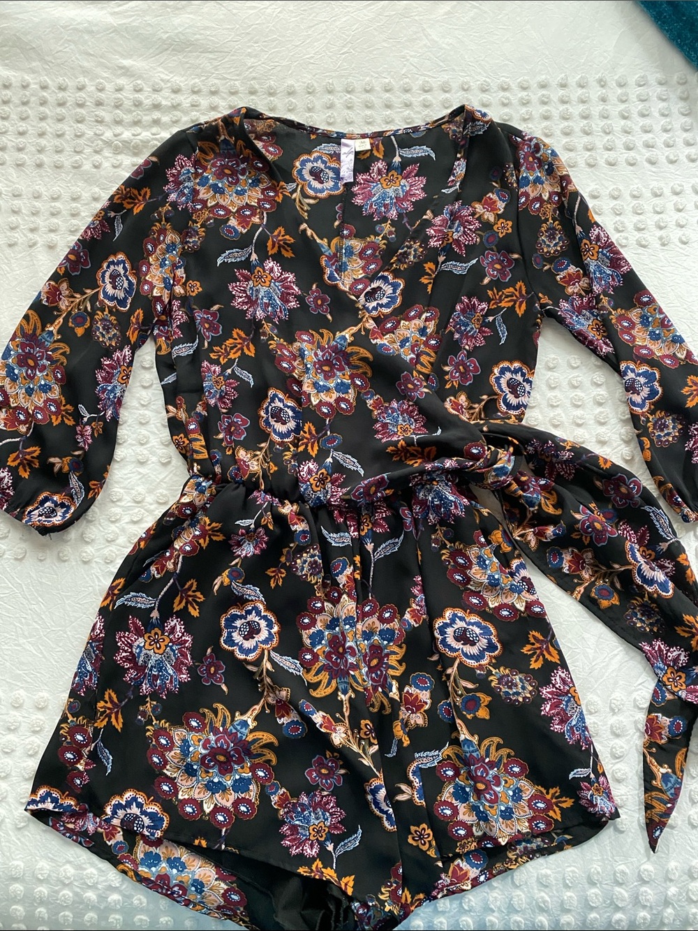 Alya Black Floral Long-Sleeve Wrap Romper with Purple & Gold Accents
